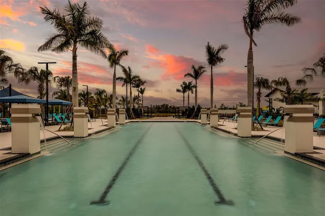 a view of a swimming pool with a house