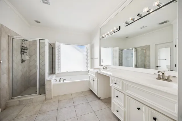 a bathroom with a sink a large mirror and a bathtub