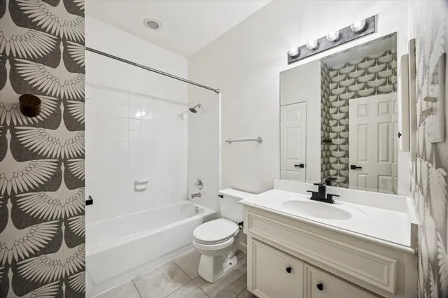 a bathroom with a toilet a sink and a bathtub
