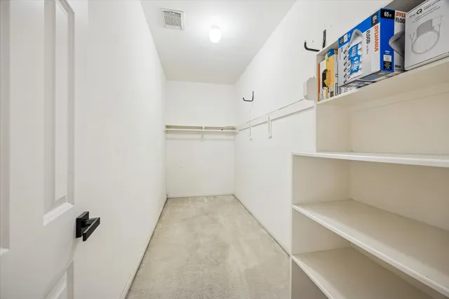 a view of storage and utility room with washer and dryer
