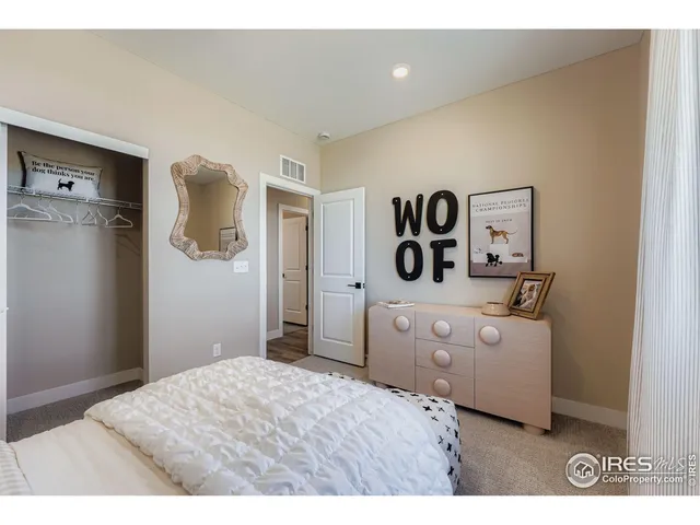 a bedroom with a bed and a bathroom