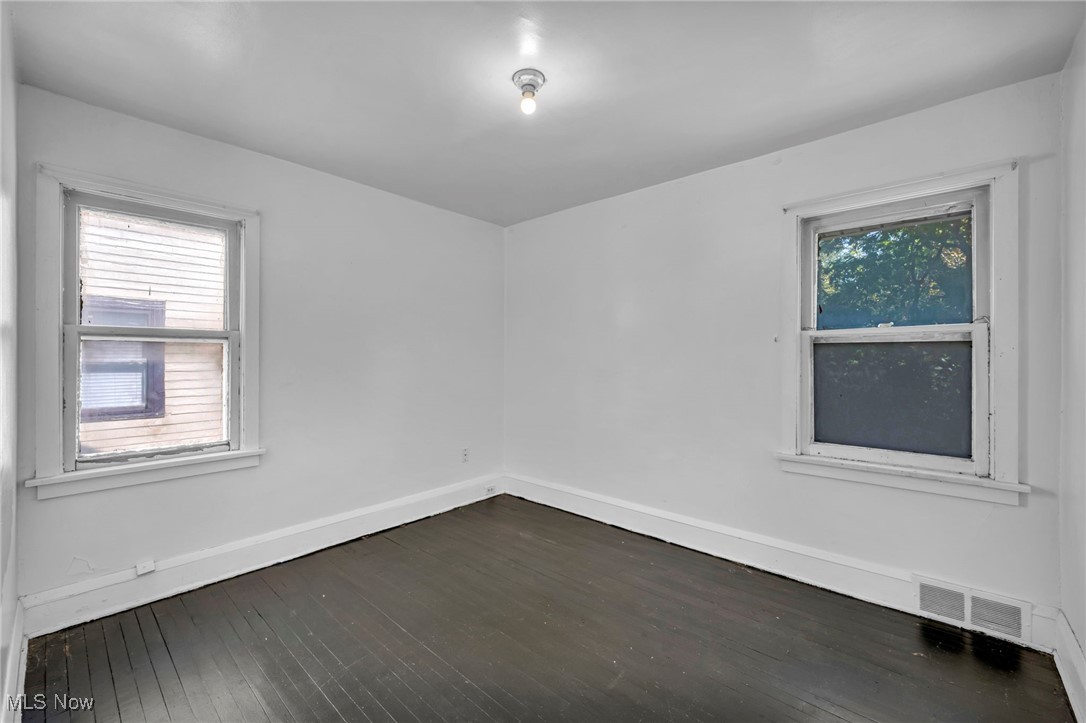 1743 Clarkstone Road Cleveland, OH 44112 - Photo 19 of 24 Bedroom with dark wood flooring