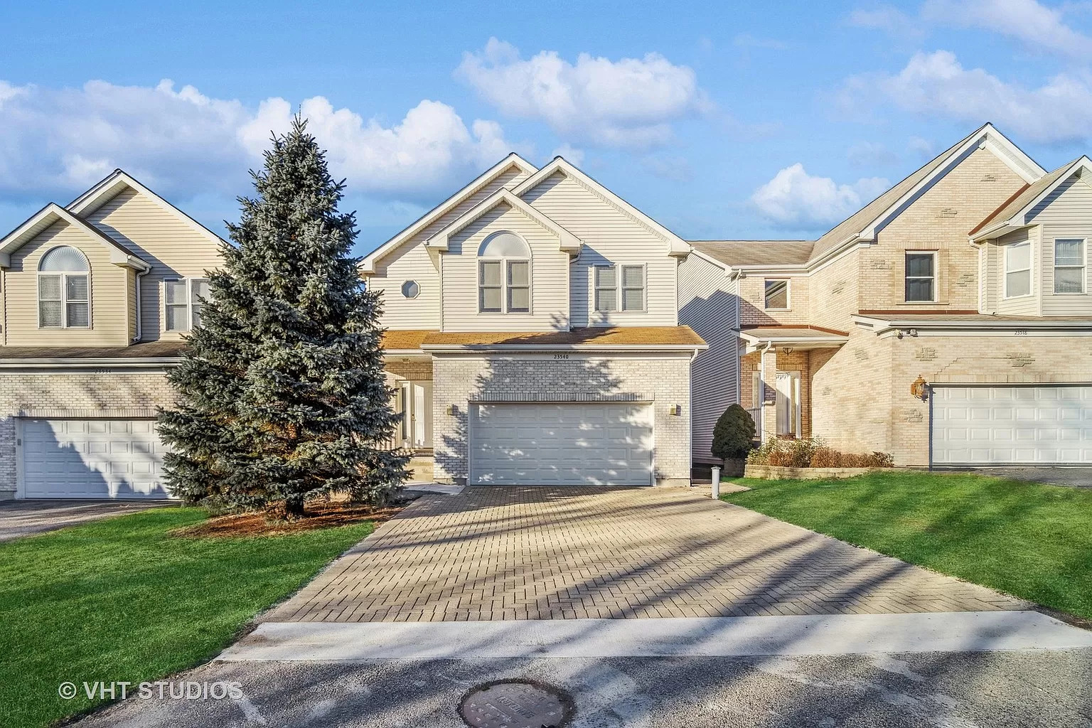 23540 North Melody Lane Lake Zurich, IL 60047 - Photo 1 of 35 a front view of a house with a yard and garage
