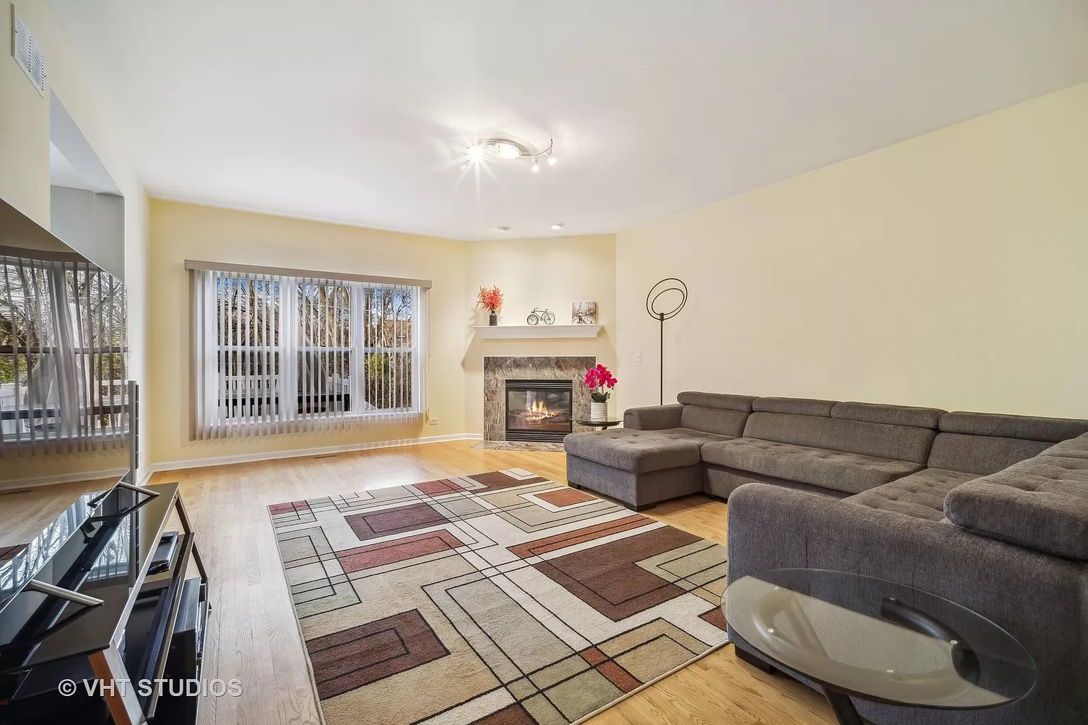 23540 North Melody Lane Lake Zurich, IL 60047 - Photo 11 of 35 a living room with furniture and a fireplace