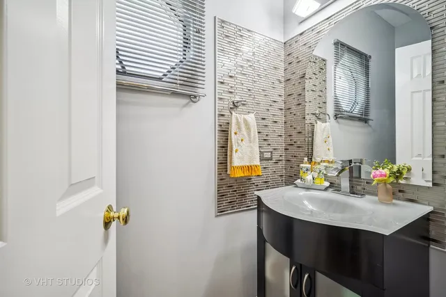 a bathroom with a sink and a window