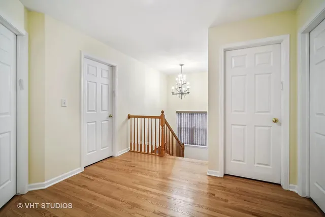 a view of a room with wooden floor and stairs