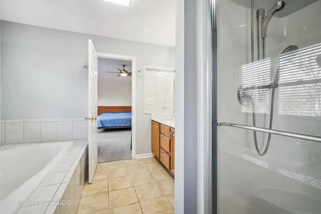 a bathroom with a tub and shower