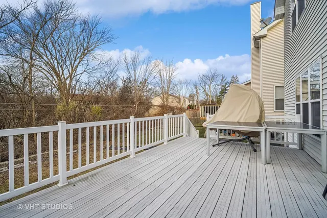 a view of roof deck with patio