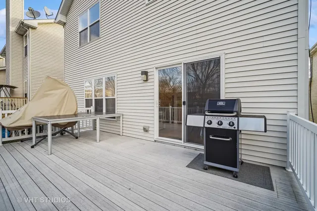 a view of a kitchen with a table and chairs