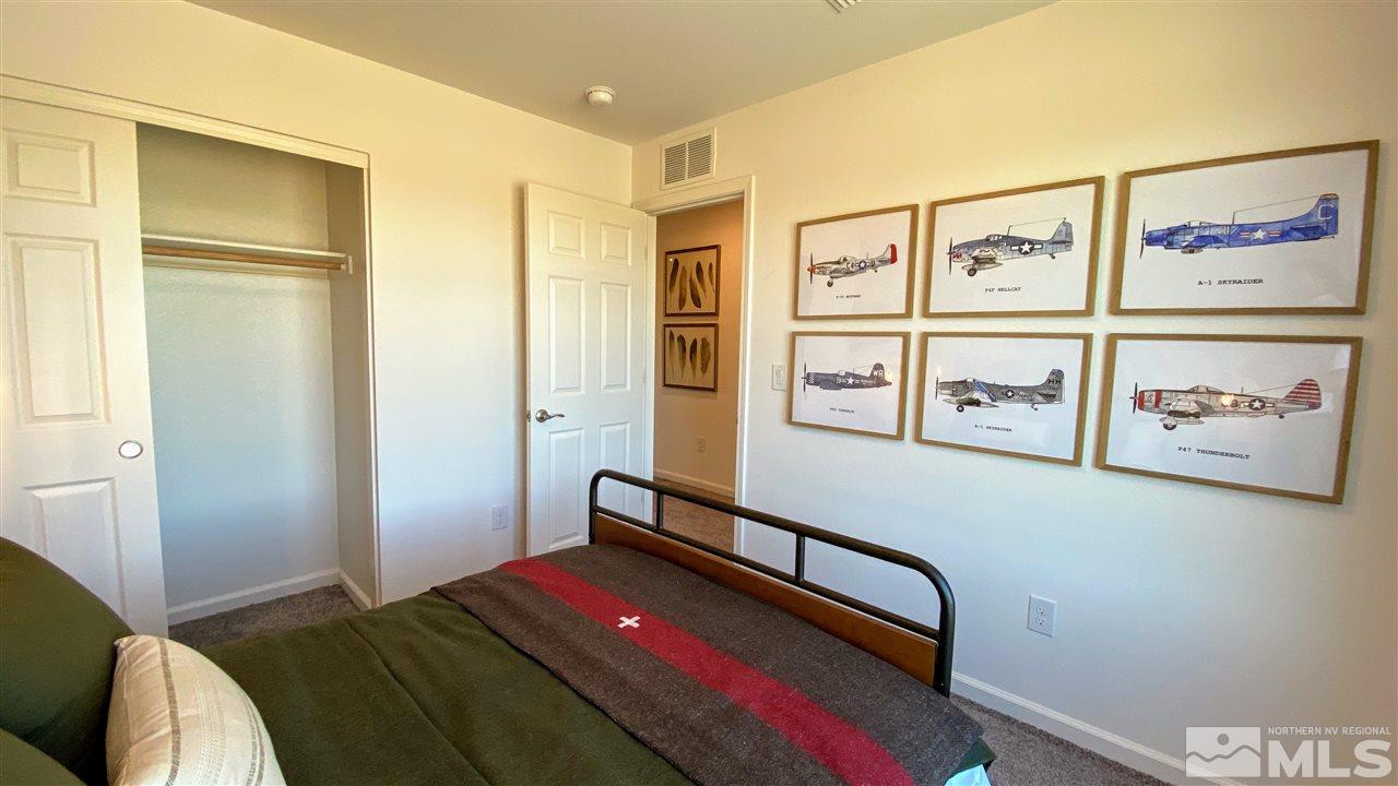 400 Autumn Breeze Circle, Unit LOT #1 Reno, NV 89511 - Photo 11 of 23 a bedroom with a bed and the view of cupboard