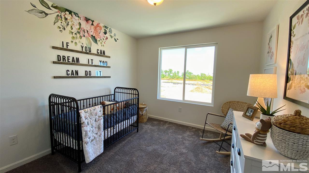 400 Autumn Breeze Circle, Unit LOT #1 Reno, NV 89511 - Photo 12 of 23 a bedroom with a bed and a window