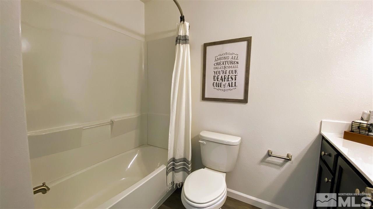 400 Autumn Breeze Circle, Unit LOT #1 Reno, NV 89511 - Photo 14 of 23 a white toilet sitting next to a bath tub