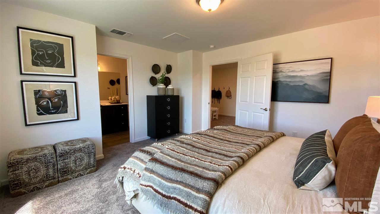 400 Autumn Breeze Circle, Unit LOT #1 Reno, NV 89511 - Photo 19 of 23 a bedroom with bed and walk in closet