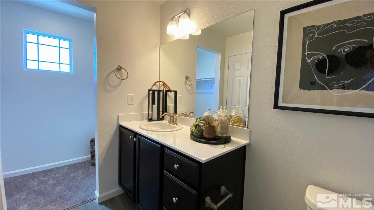400 Autumn Breeze Circle, Unit LOT #1 Reno, NV 89511 - Photo 20 of 23 a bathroom with a sink and a mirror