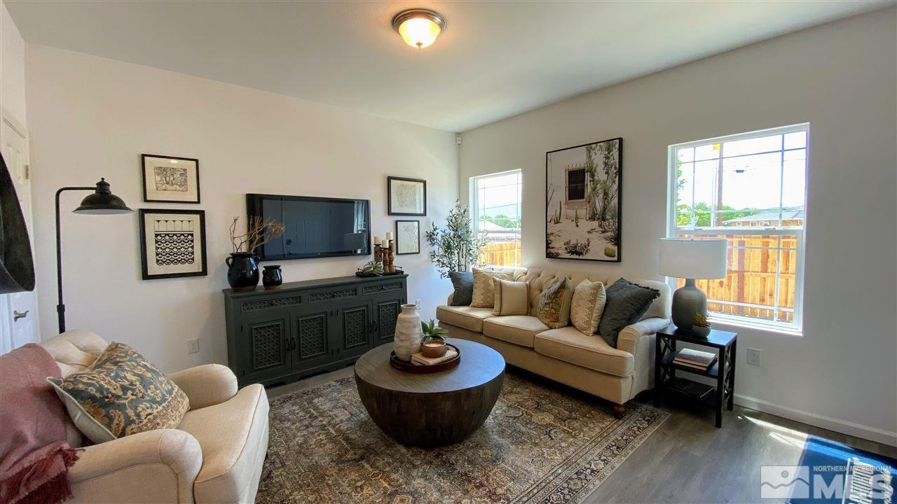 400 Autumn Breeze Circle, Unit LOT #1 Reno, NV 89511 - Photo 3 of 23 a living room with furniture and a flat screen tv