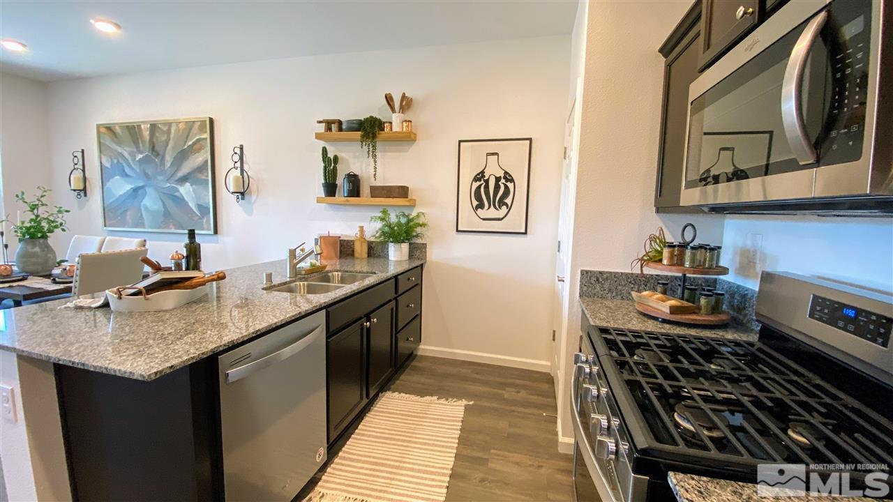 400 Autumn Breeze Circle, Unit LOT #1 Reno, NV 89511 - Photo 7 of 23 a kitchen with a stove and a sink