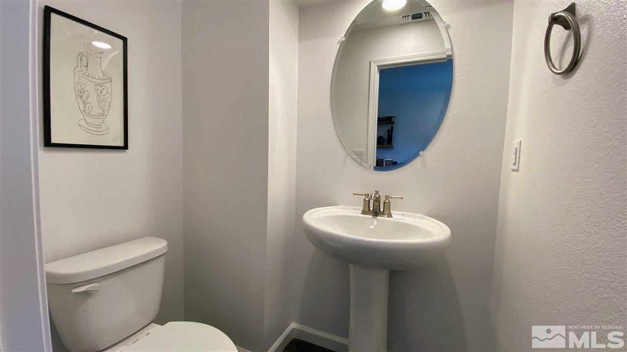 400 Autumn Breeze Circle, Unit LOT #1 Reno, NV 89511 - Photo 9 of 23 a bathroom with a toilet sink and mirror