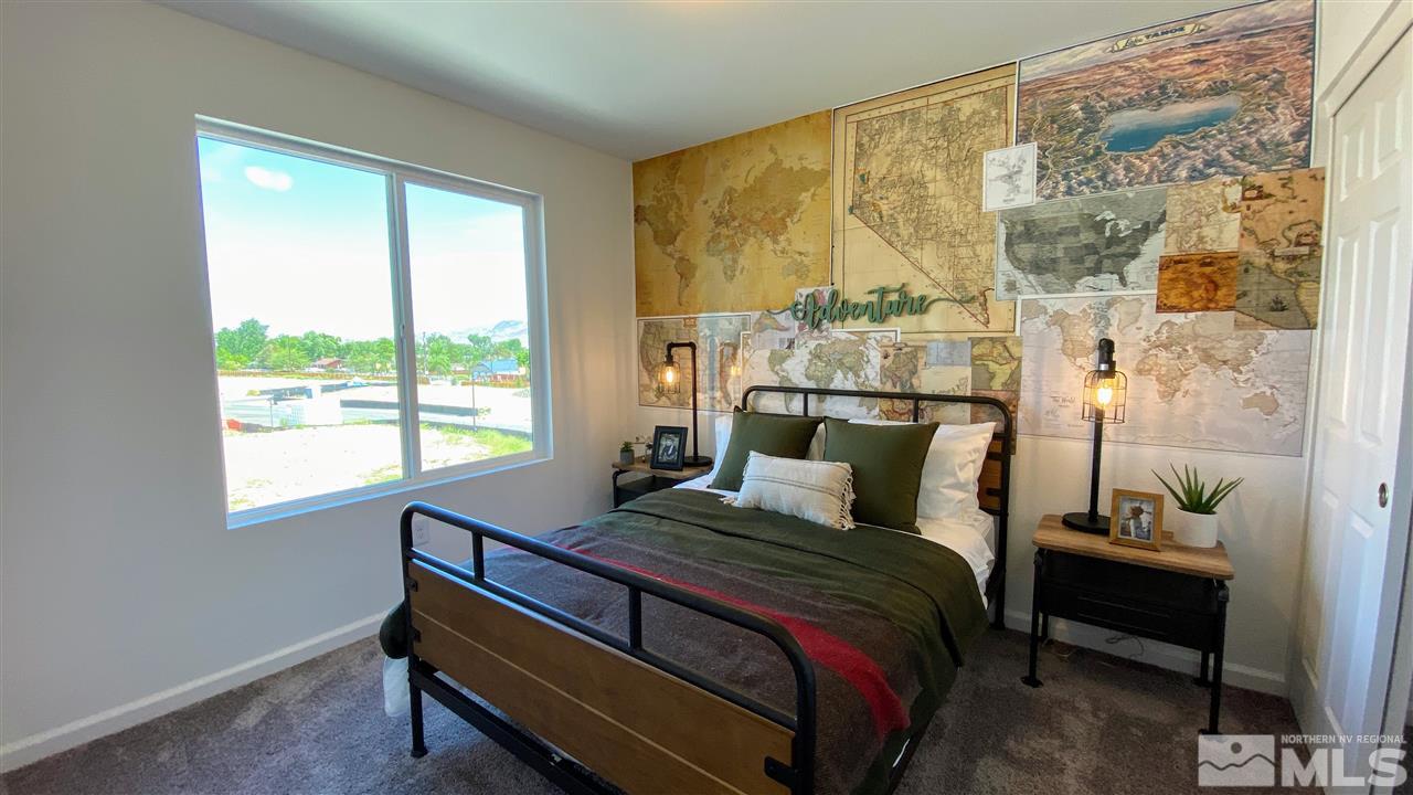 400 Autumn Breeze Circle, Unit LOT #1 Reno, NV 89511 - Photo 10 of 23 a bedroom with a bed and a window