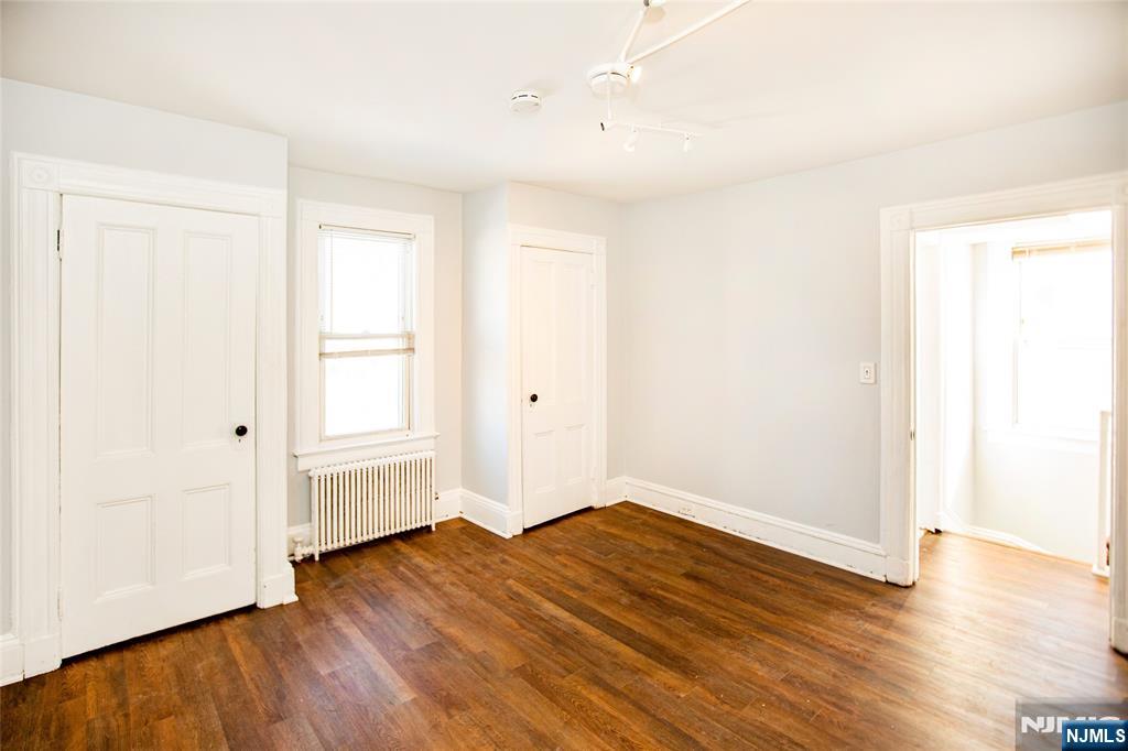 472 Passaic Street Hackensack, NJ 07601 - Photo 15 of 22 an empty room with wooden floor