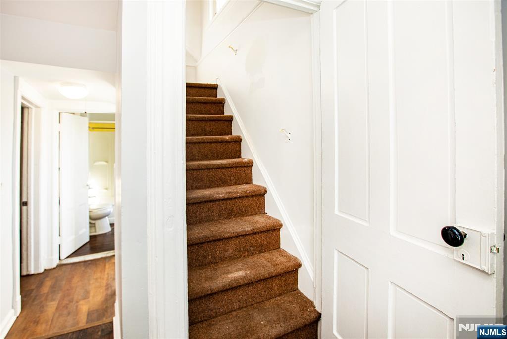 472 Passaic Street Hackensack, NJ 07601 - Photo 16 of 22 a view of a hallway with wooden floor and entryway