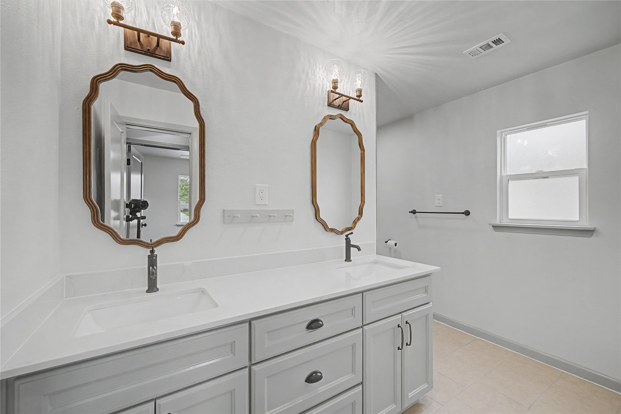 1108 Nottingham Drive Angleton, TX 77515 - Photo 18 of 27 a bathroom with a sink a mirror and vanity