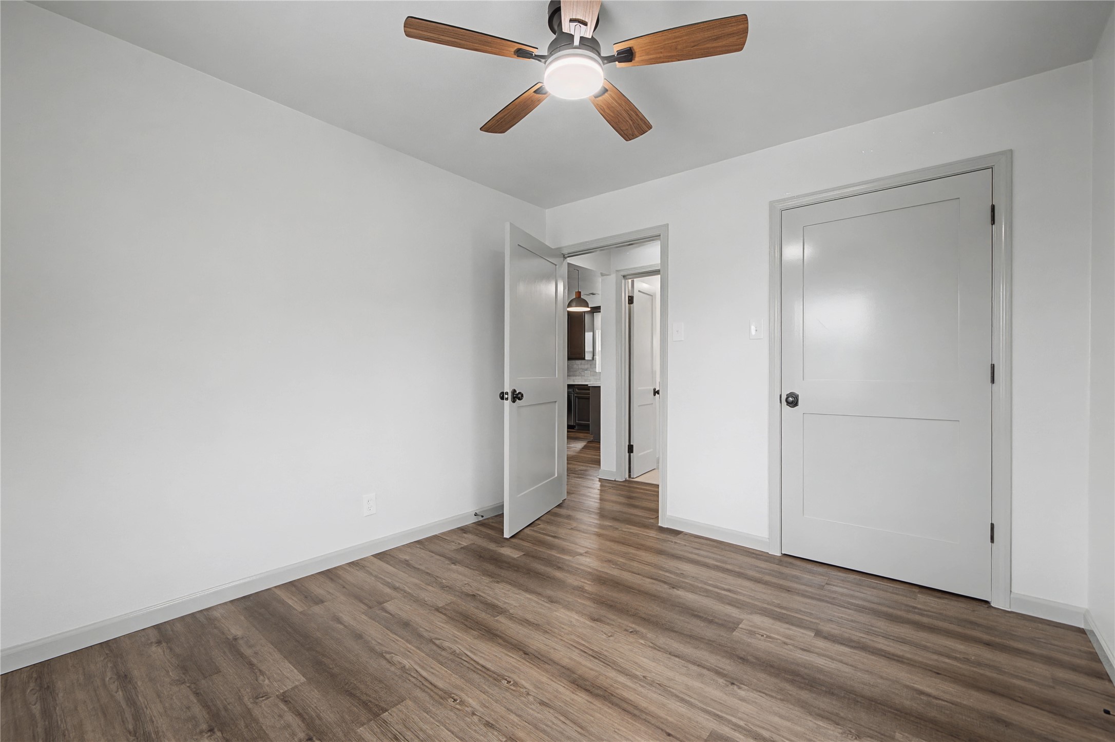 1108 Nottingham Drive Angleton, TX 77515 - Photo 20 of 27 a view of empty room with wooden floor
