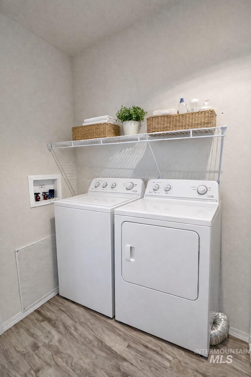 1500 West 7th Street Weiser, ID 83672 - Photo 6 of 10 Washroom featuring light wood finished floors and hookup for a washing machine