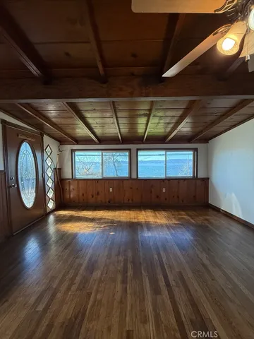 a view of room with wooden floor