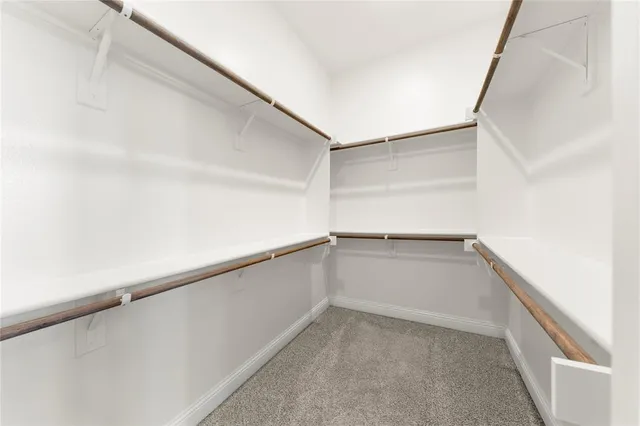 a view of an empty walk in closet