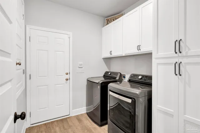 a kitchen with a stove and a microwave