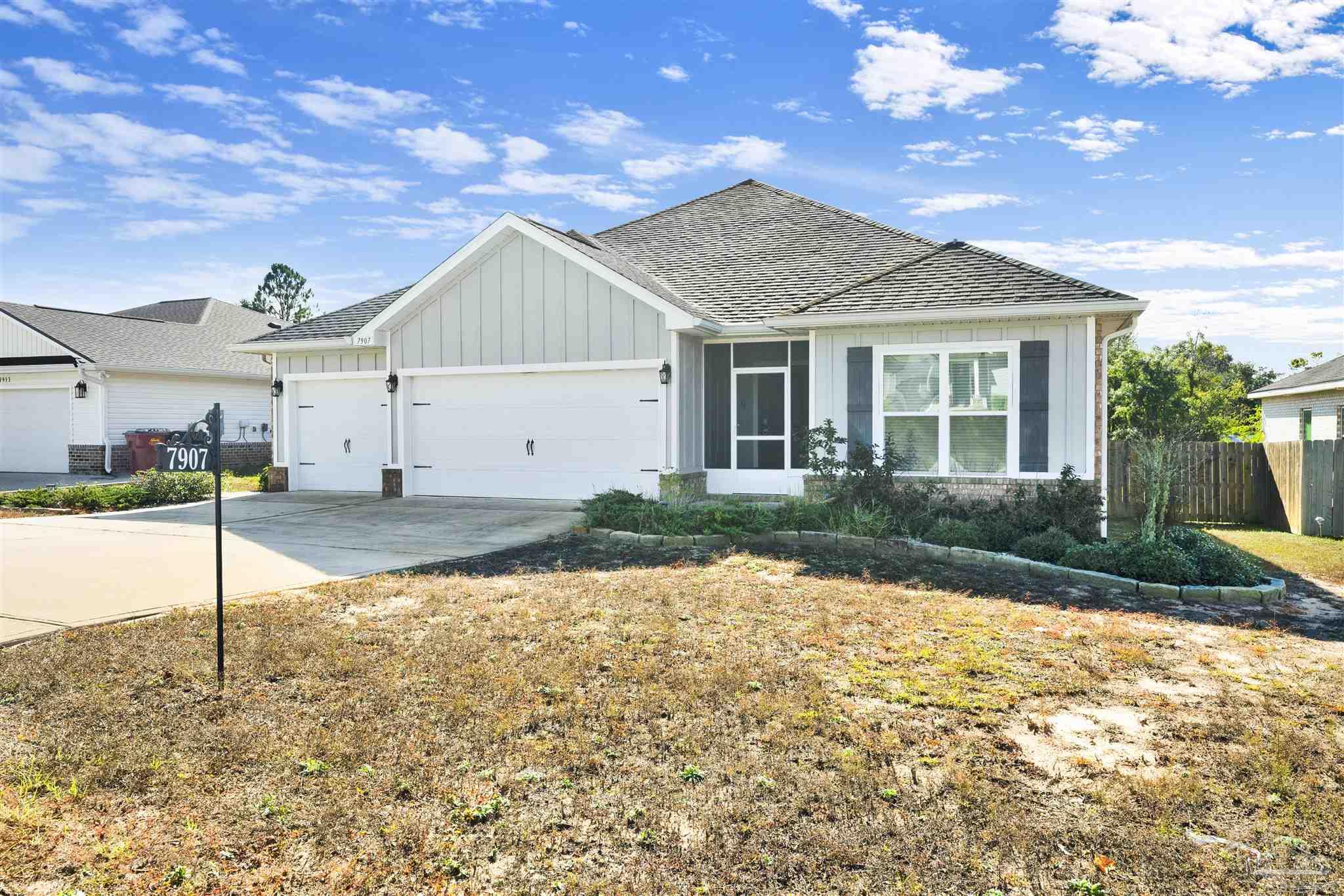 7907 Majestic Cypress Drive Milton, FL 32583 - Photo 2 of 36 a view of a house next to a yard
