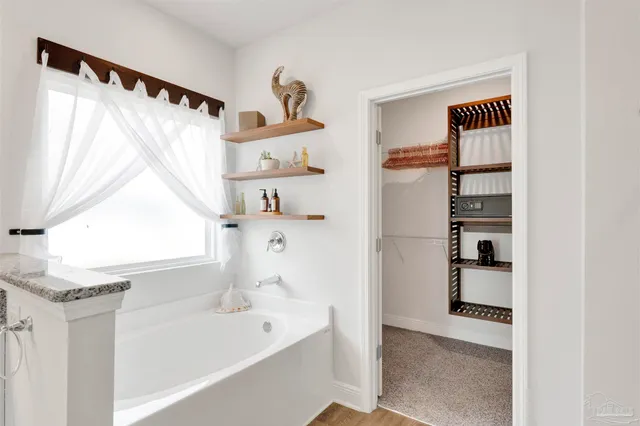 a bathroom with a bathtub and a shower