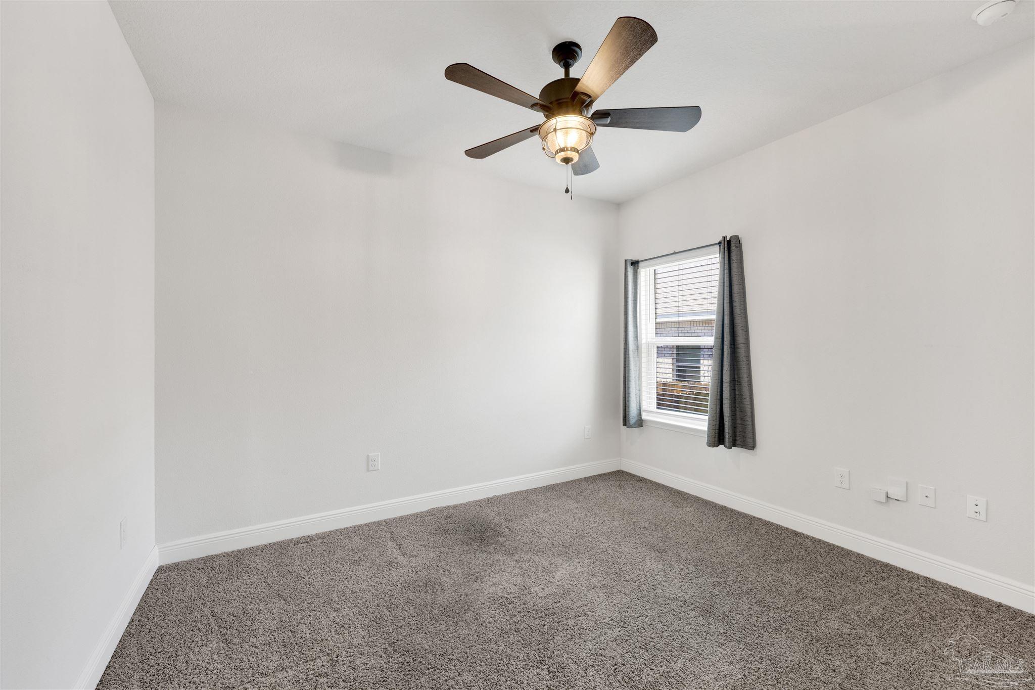 7907 Majestic Cypress Drive Milton, FL 32583 - Photo 28 of 36 an empty room