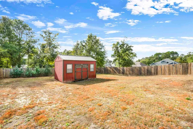 a backyard of a house with lots of green space
