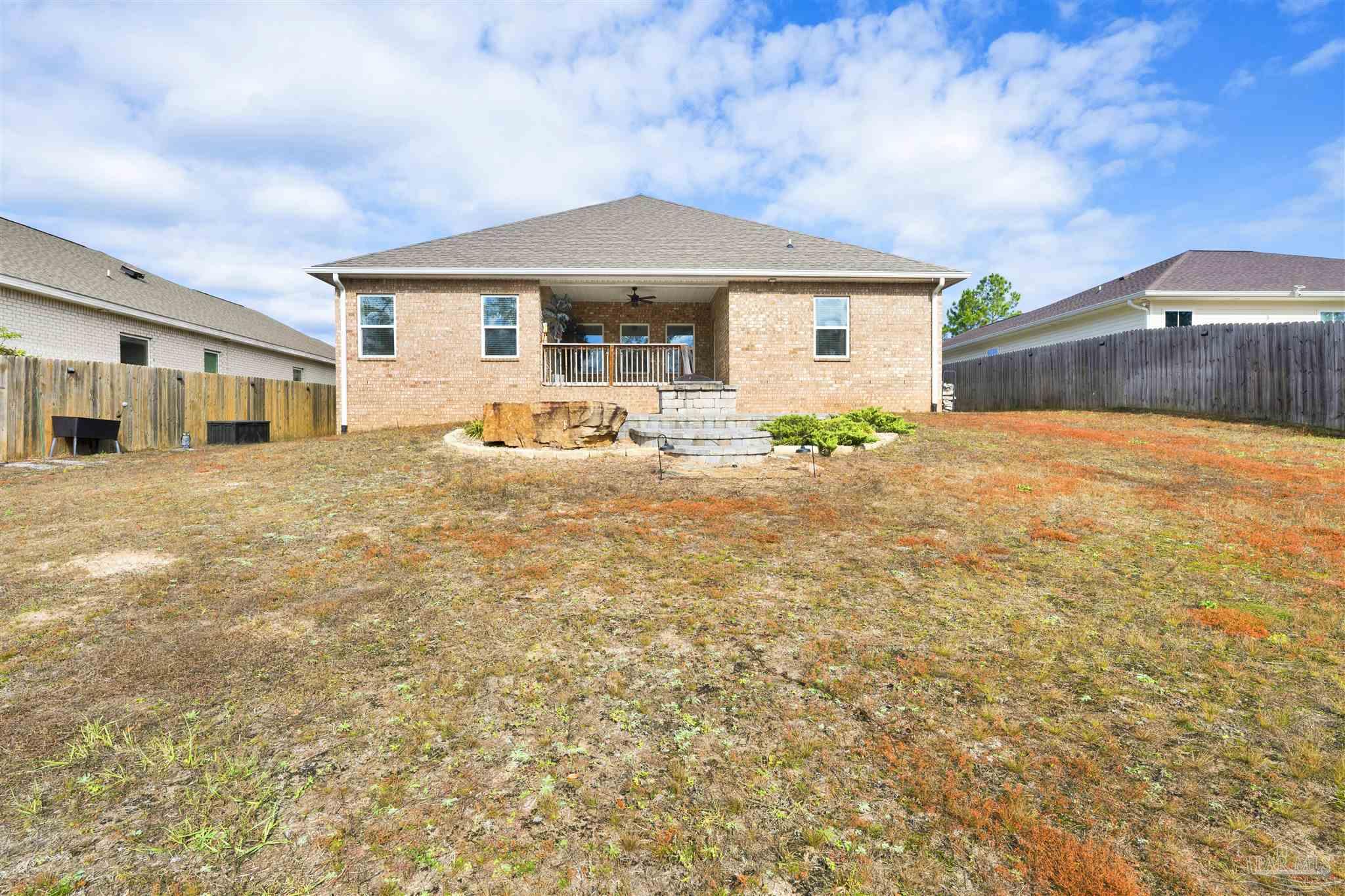 7907 Majestic Cypress Drive Milton, FL 32583 - Photo 34 of 36 a house view with a garden space
