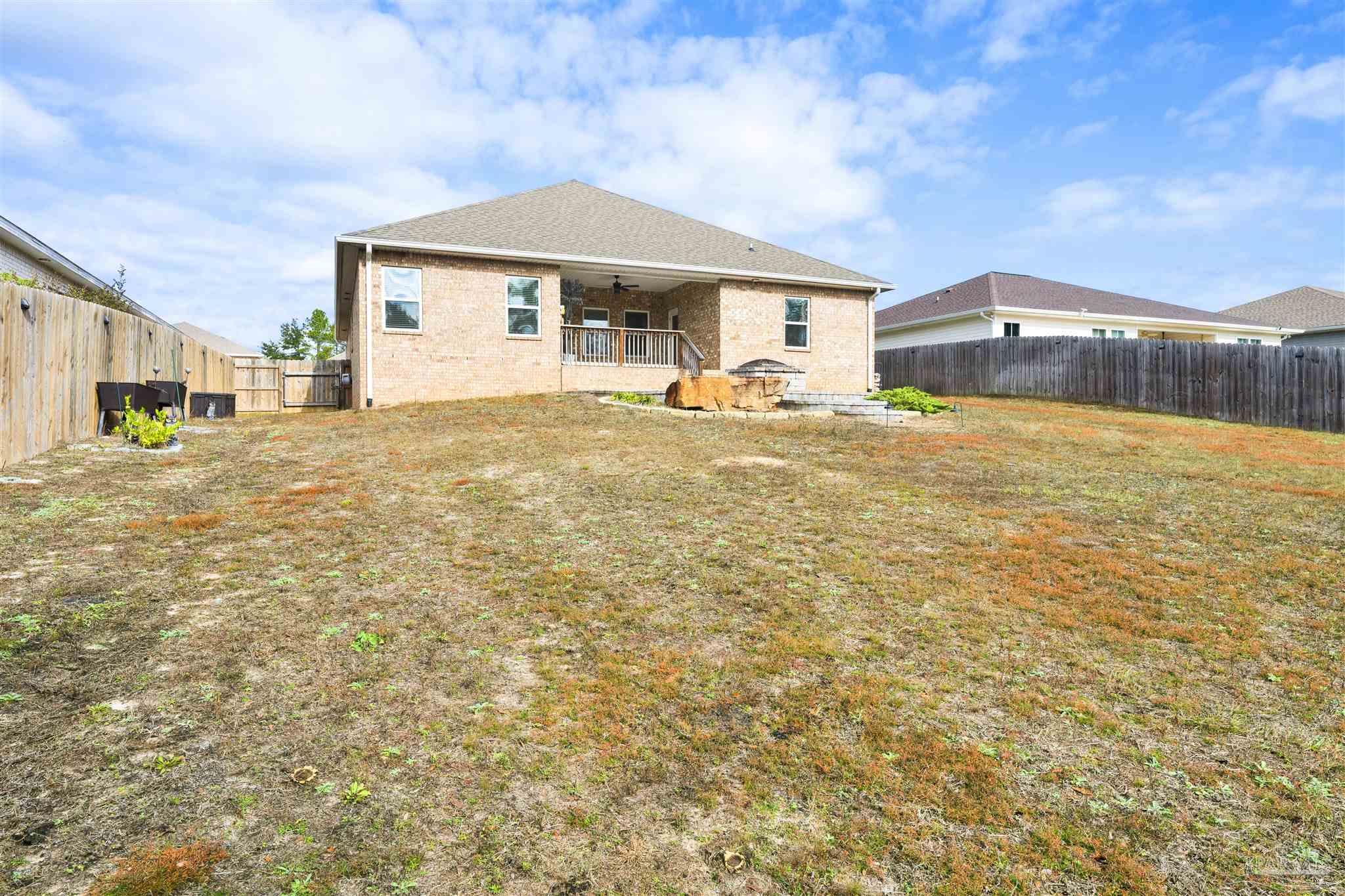 7907 Majestic Cypress Drive Milton, FL 32583 - Photo 35 of 36 a front view of a house with a yard