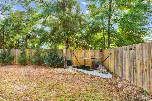 a view of outdoor space with wooden fence