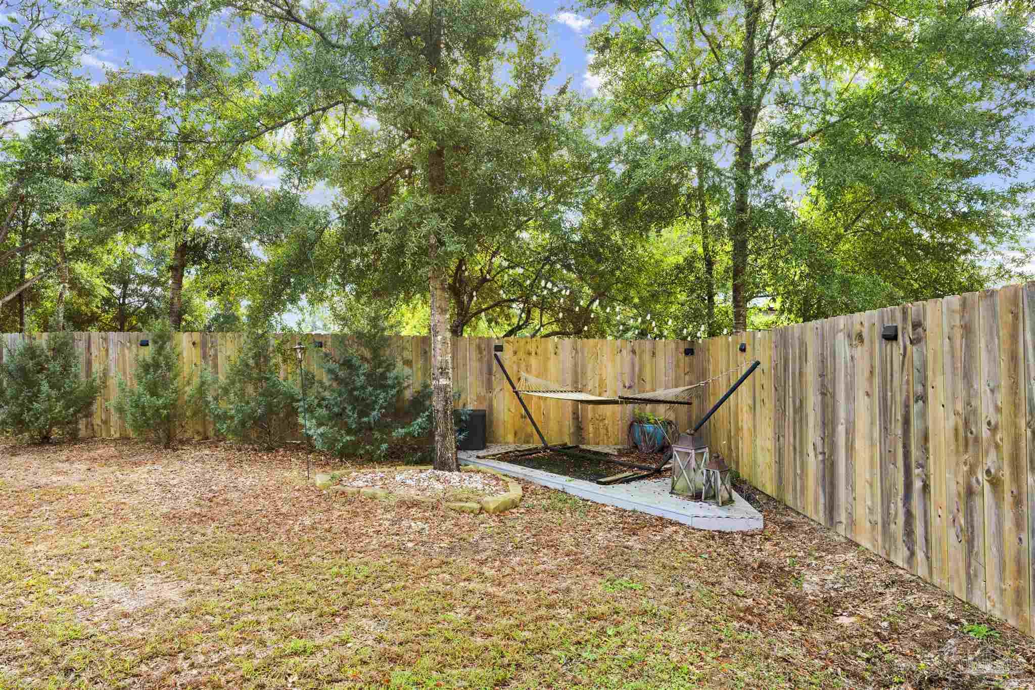 7907 Majestic Cypress Drive Milton, FL 32583 - Photo 36 of 36 a view of outdoor space with wooden fence