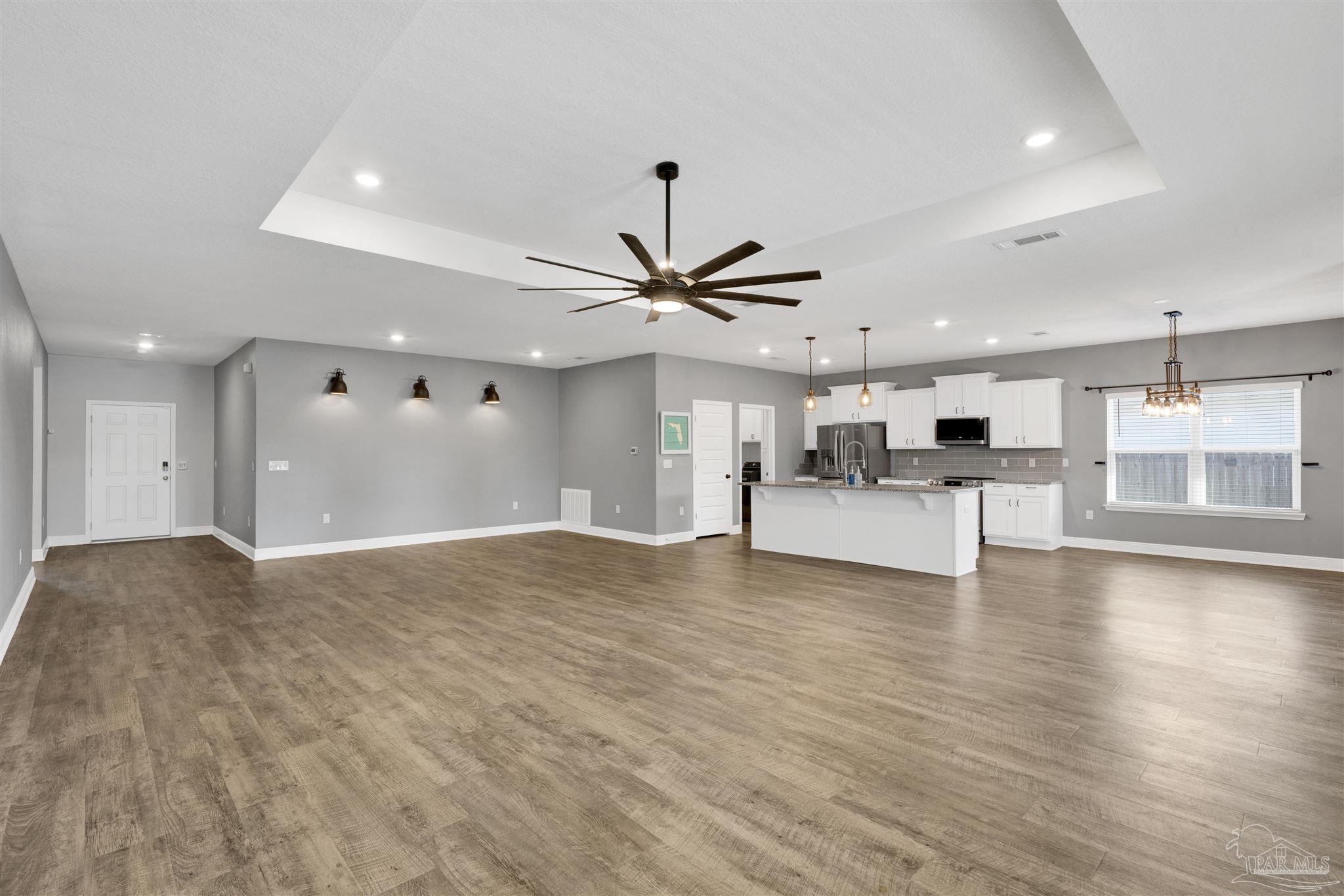 7907 Majestic Cypress Drive Milton, FL 32583 - Photo 8 of 36 a view of an empty room with kitchen and window