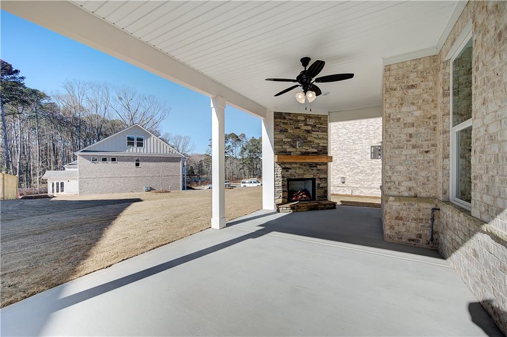 143 Dalston Cove Stockbridge, GA 30281 - Photo 18 of 32 a living room with a couch and fireplace