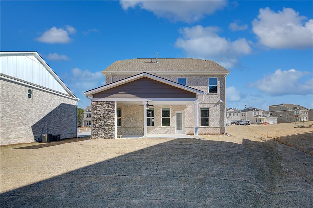 143 Dalston Cove Stockbridge, GA 30281 - Photo 30 of 32 a front view of a house with a yard