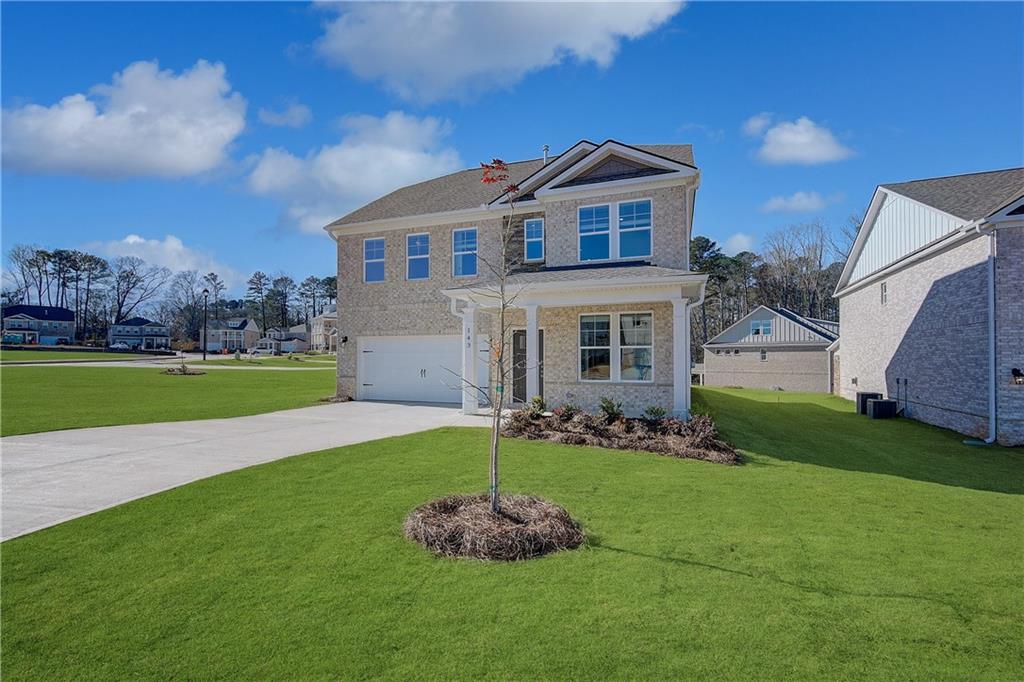 143 Dalston Cove Stockbridge, GA 30281 - Photo 3 of 32 a front view of a house with a yard