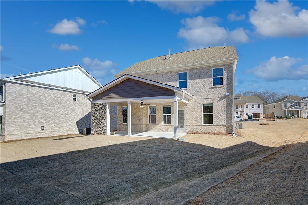 143 Dalston Cove Stockbridge, GA 30281 - Photo 31 of 32 a view of a white house with wooden fence