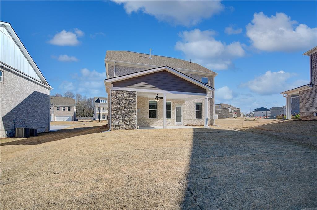 143 Dalston Cove Stockbridge, GA 30281 - Photo 32 of 32 a front view of a house with a yard and garage