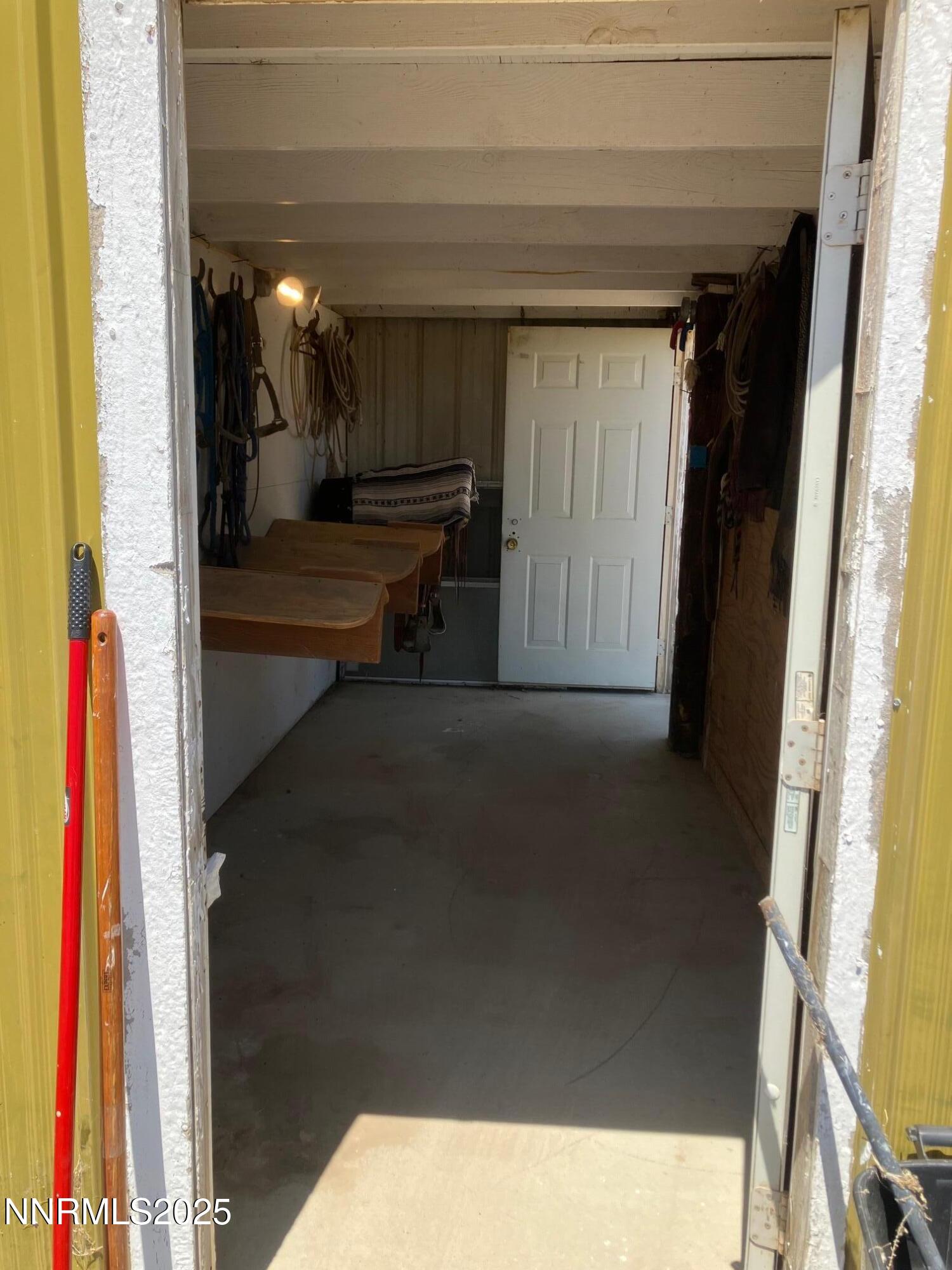 1200 Van Diest Road Winnemucca, NV 89445 - Photo 12 of 28 a view of living room with a chair and frames on wall