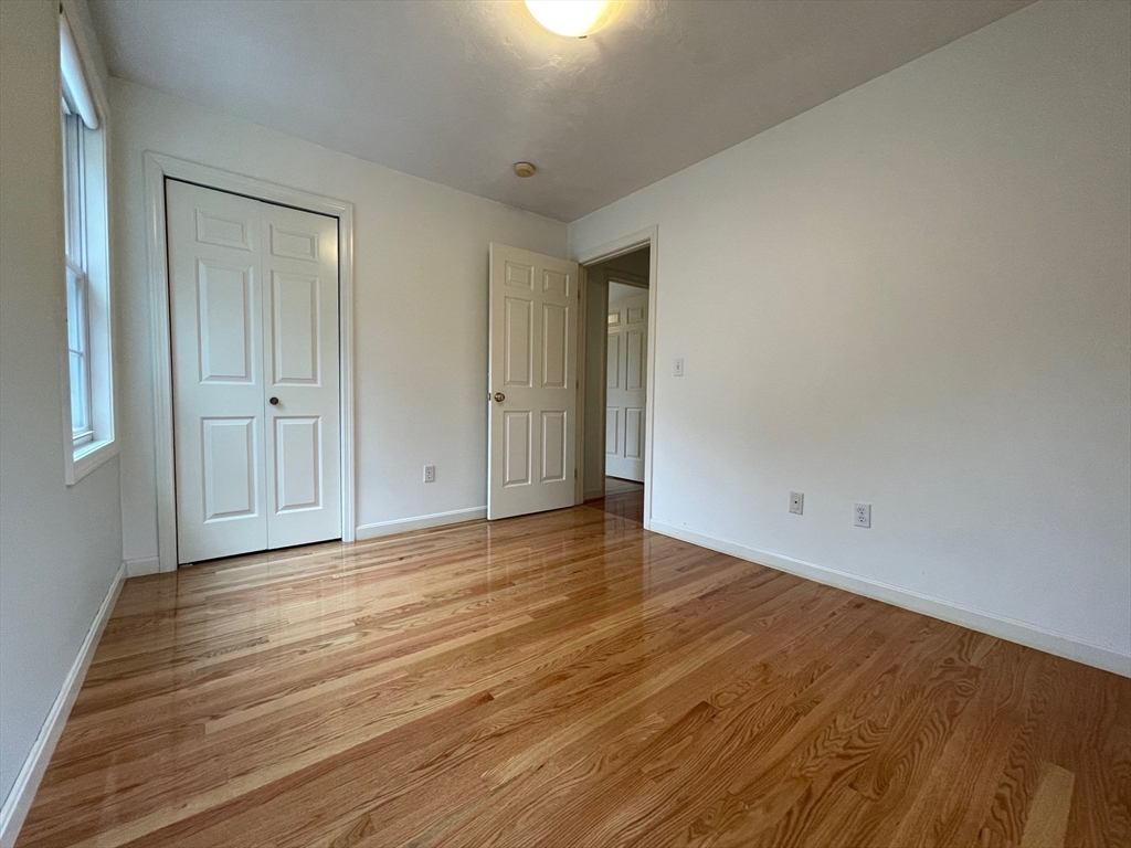 72 Cedar Road North Medford, MA 02155 - Photo 13 of 19 a view of an empty room and wooden floor