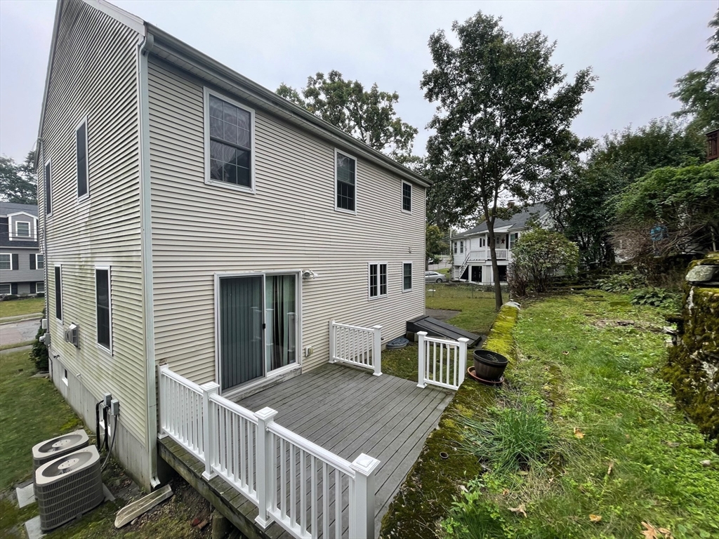 72 Cedar Road North Medford, MA 02155 - Photo 17 of 19 a view of a house with backyard and sitting area