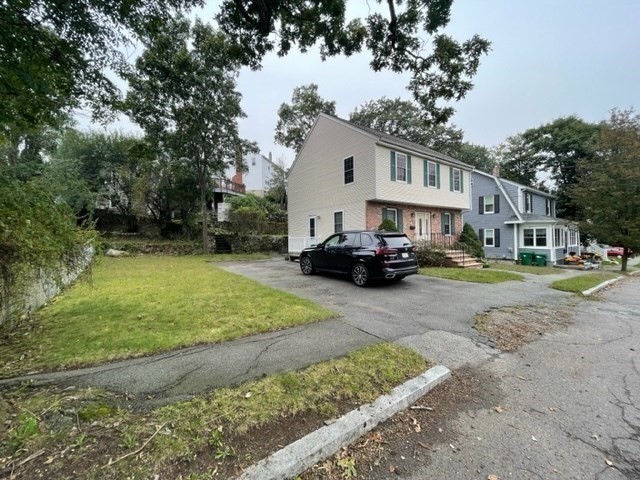 72 Cedar Road North Medford, MA 02155 - Photo 18 of 19 a car parked in front of white house