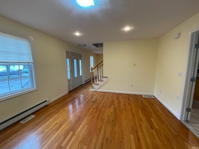 72 Cedar Road North Medford, MA 02155 - Photo 3 of 19 a view of empty room with wooden floor and fan