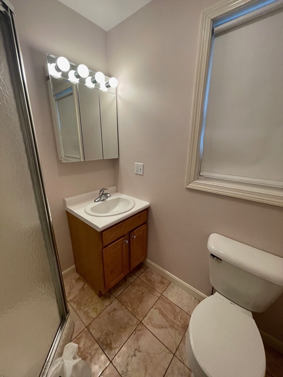 72 Cedar Road North Medford, MA 02155 - Photo 10 of 19 a bathroom with a toilet sink and mirror